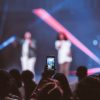 shallow focus of smartphone videoing concert